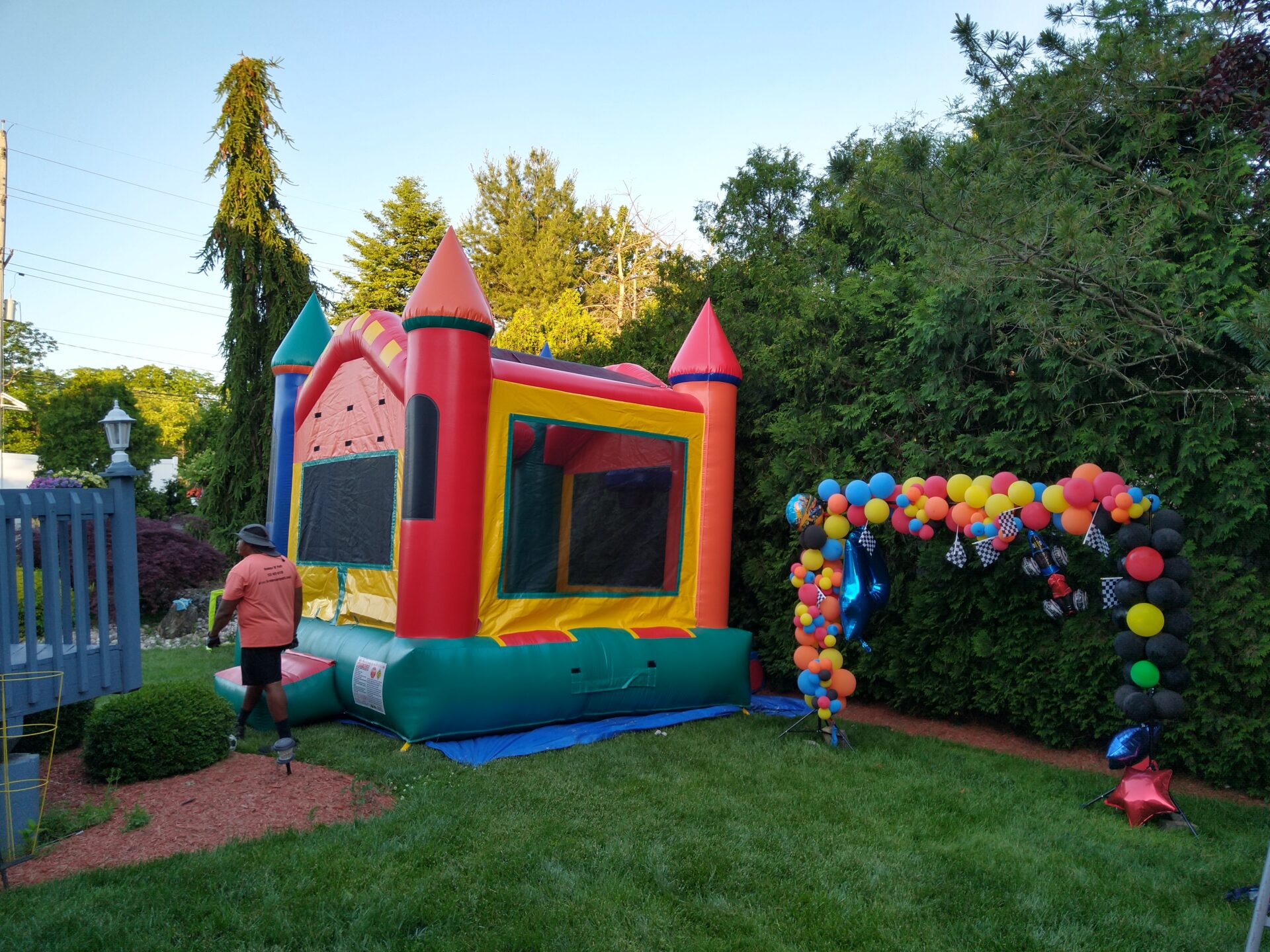A bouncy castle in a yard.