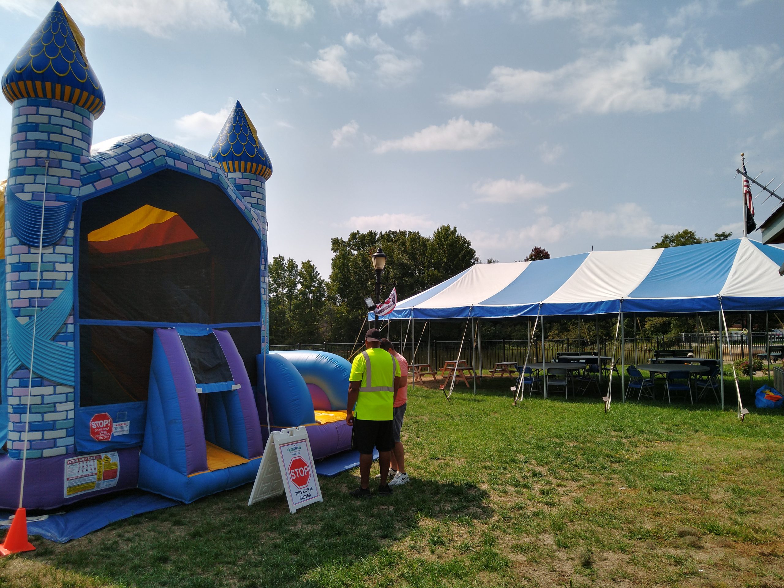 A bounce house with a castle on it.