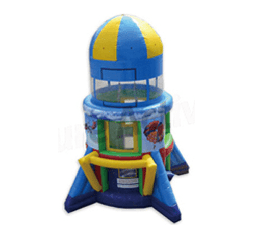 A blue and yellow bounce house with a rocket on it.